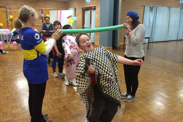 Children playing limbo. Link displays a larger version of the image.